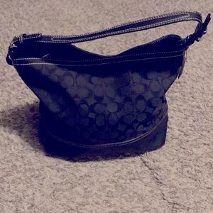 Black coach handbag. Few stains inside. Fair condition other than that.